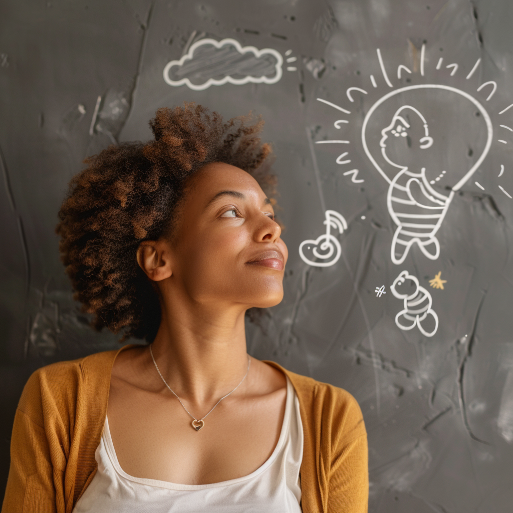 image of a young woman with a baby drawn on black board