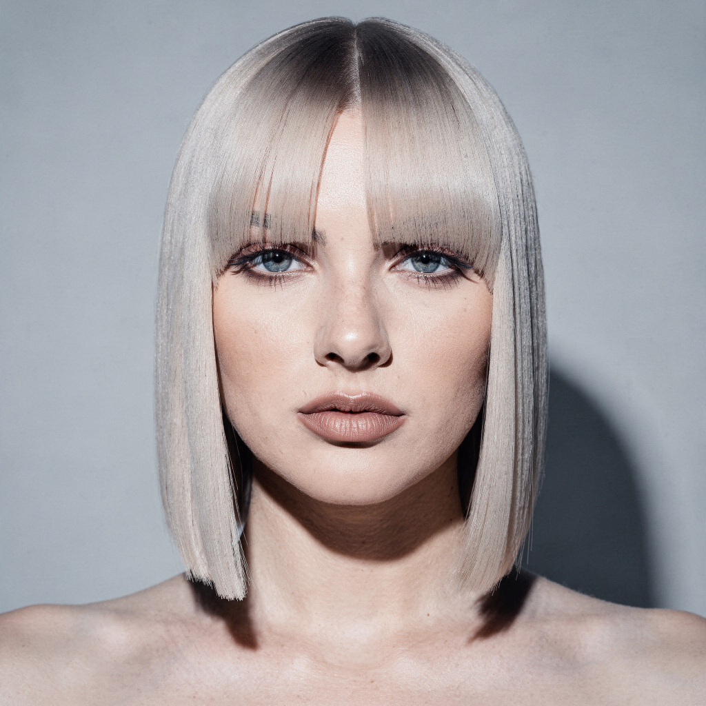 Ash blonde sleek straight hair on a woman