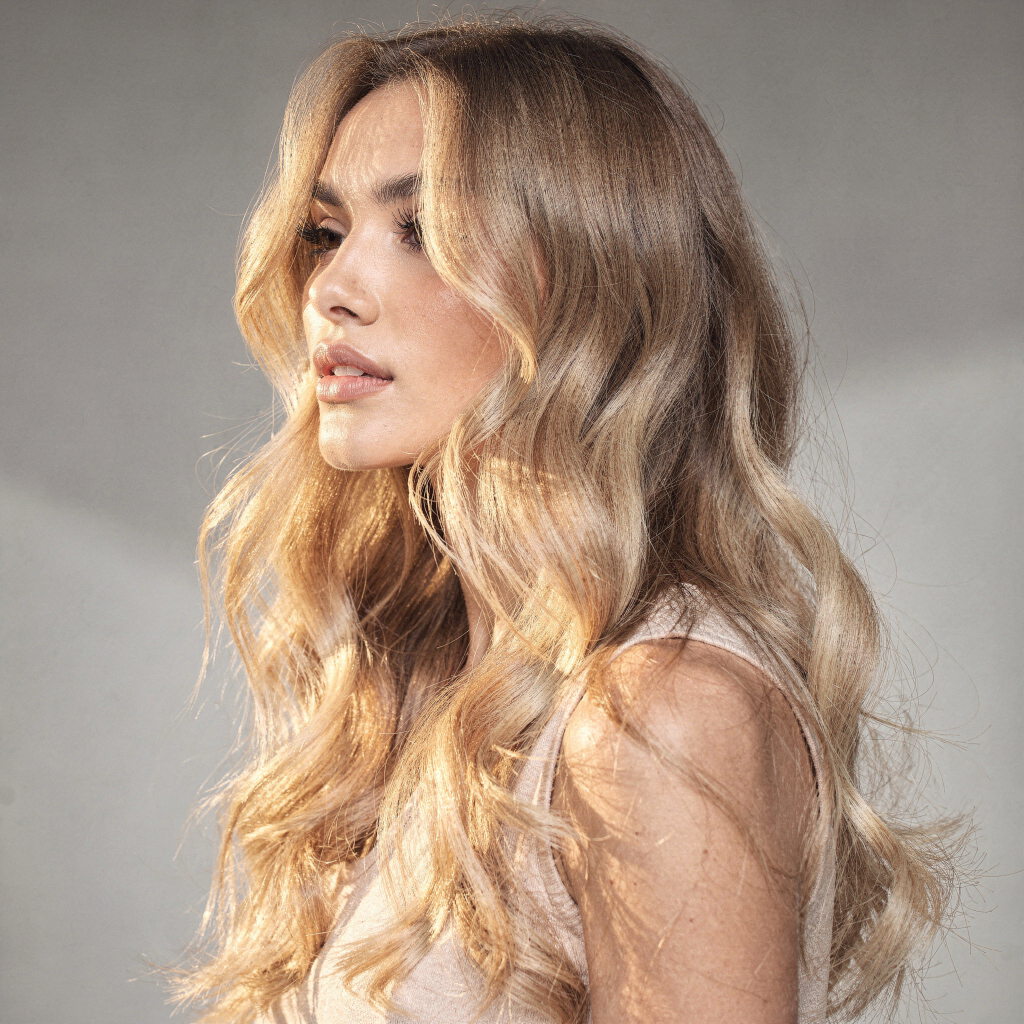 Beige bronde natural waves long hair on woman