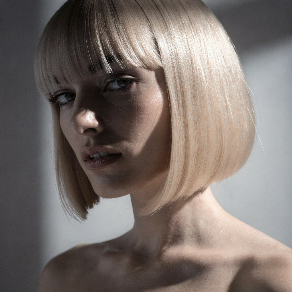 Champagne blonde blunt bob hairstyle on woman