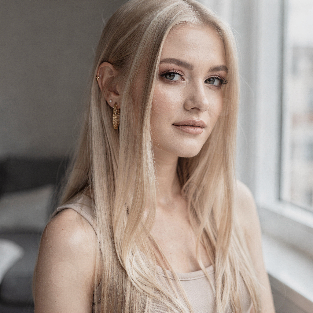 Young woman with Scandinavian icy blonde babylights hair.