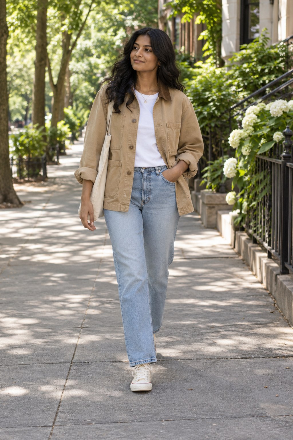 Lightweight barn jacket worn open over a cotton tee on a mild sunny day.